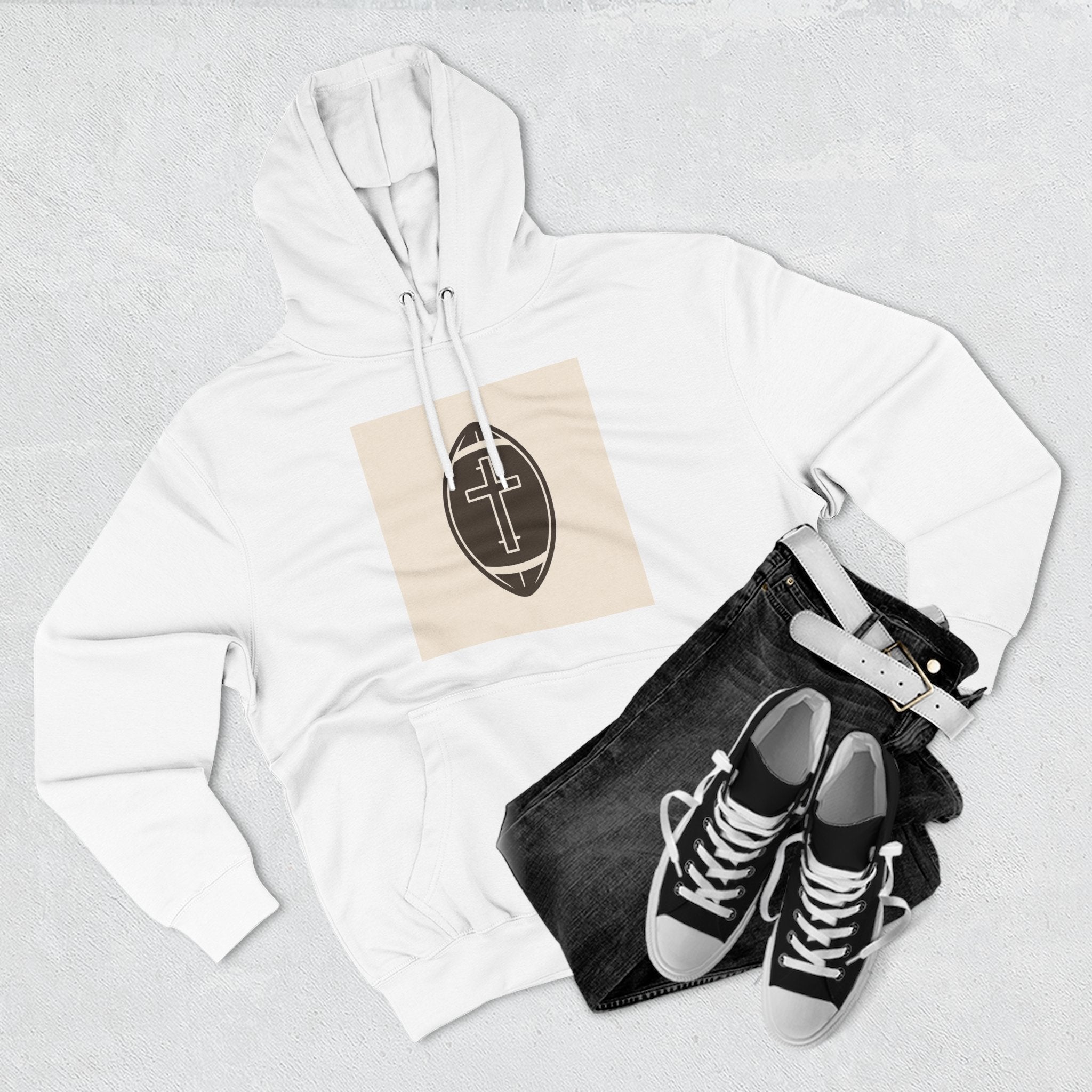 A cozy hoodie that unites faith and football with a bold cross set inside a classic football design.